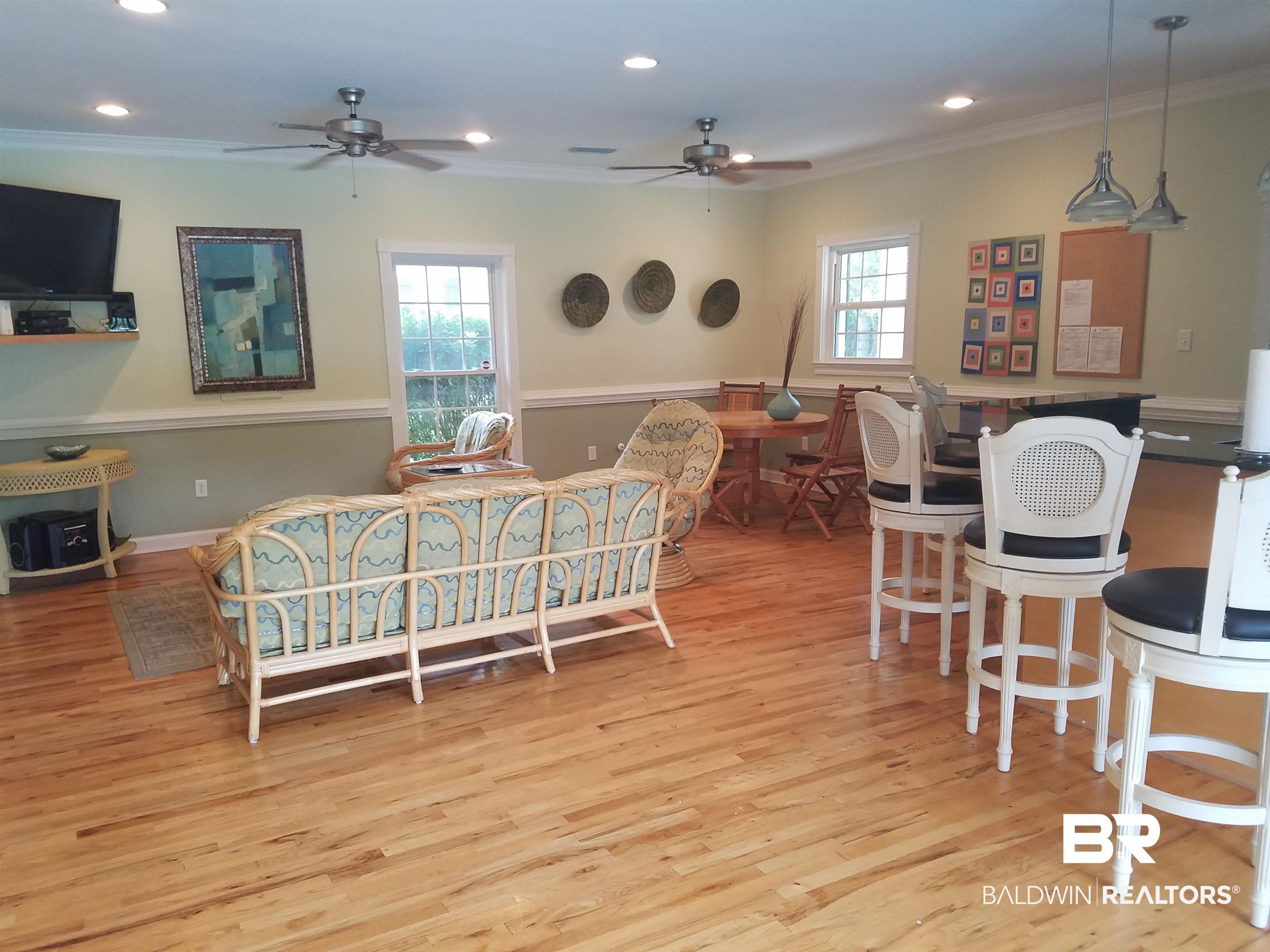 214 Upham Street, Unit 7C Mobile, AL 36607 - Photo 29 of 32 Living area featuring a ceiling fan, healthy amount of natural light, light wood-style floors, recessed lighting, and ornamental molding