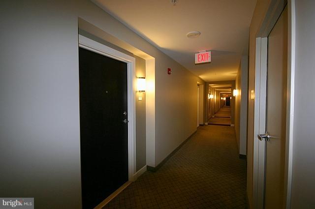 851 North Glebe Road, Unit 810 Arlington, VA 22203 - Photo 13 of 28 a front view of a hallway with wooden floor