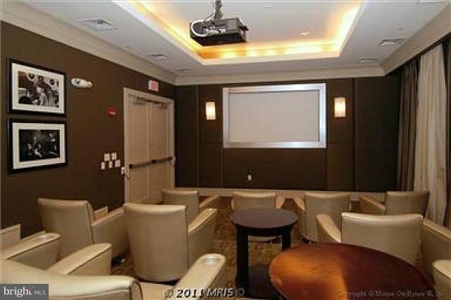 851 North Glebe Road, Unit 810 Arlington, VA 22203 - Photo 17 of 28 a living room with furniture and a flat screen tv