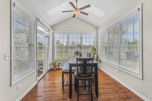 a view of a dining room with furniture window and wooden floor