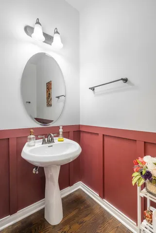 a bathroom with a sink mirror and vanity