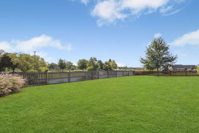 a view of a field and trees