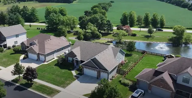 an aerial view of a house with a garden