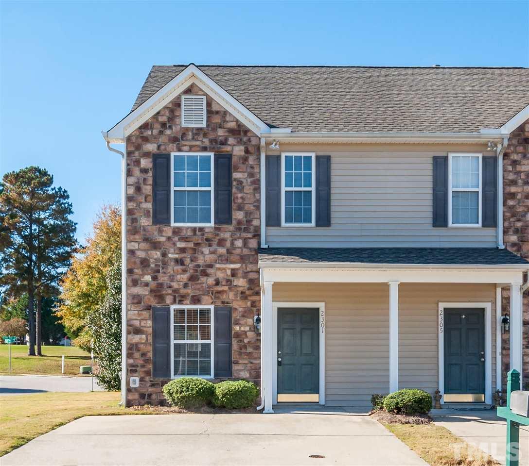 2301 Bay Harbor Drive Raleigh, NC 27604 - Photo 1 of 25 a front view of a house with a yard