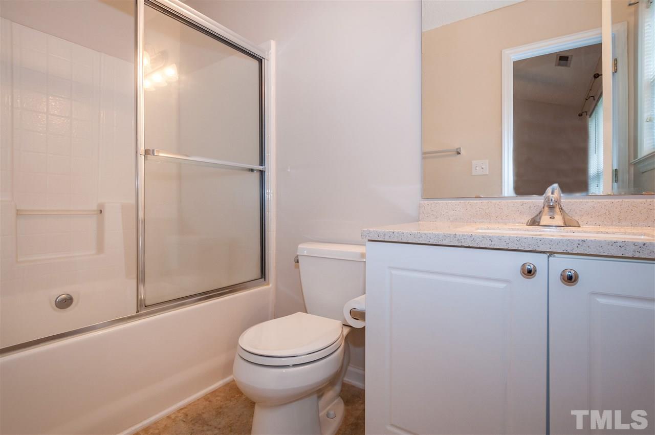 2301 Bay Harbor Drive Raleigh, NC 27604 - Photo 11 of 25 a bathroom with a sink a toilet and shower