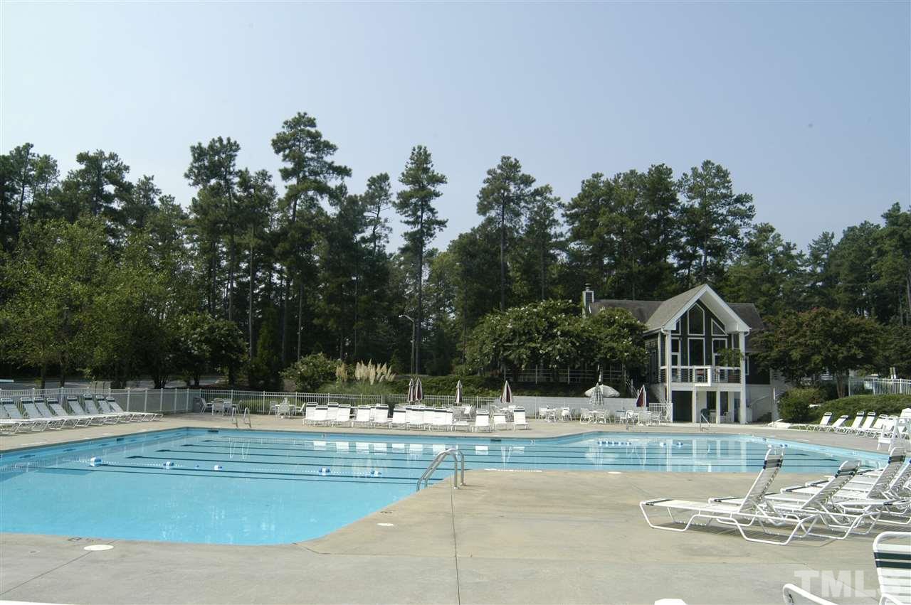 2301 Bay Harbor Drive Raleigh, NC 27604 - Photo 21 of 25 a view of swimming pool with outdoor seating and yard in back