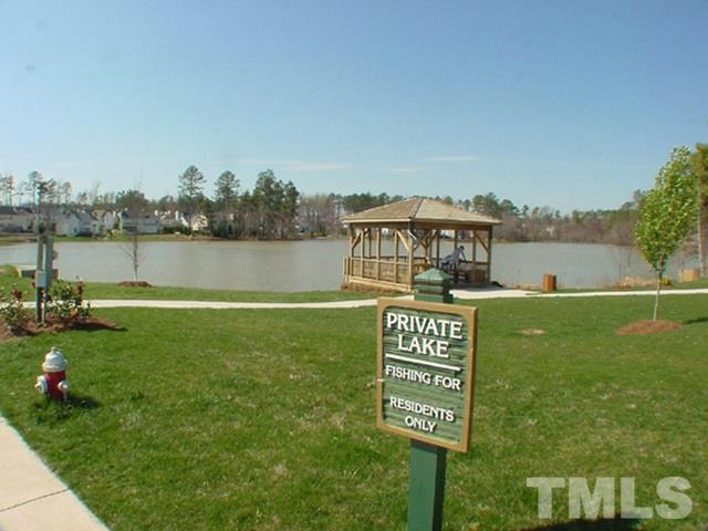 2301 Bay Harbor Drive Raleigh, NC 27604 - Photo 24 of 25 a view of a lake with houses in the back