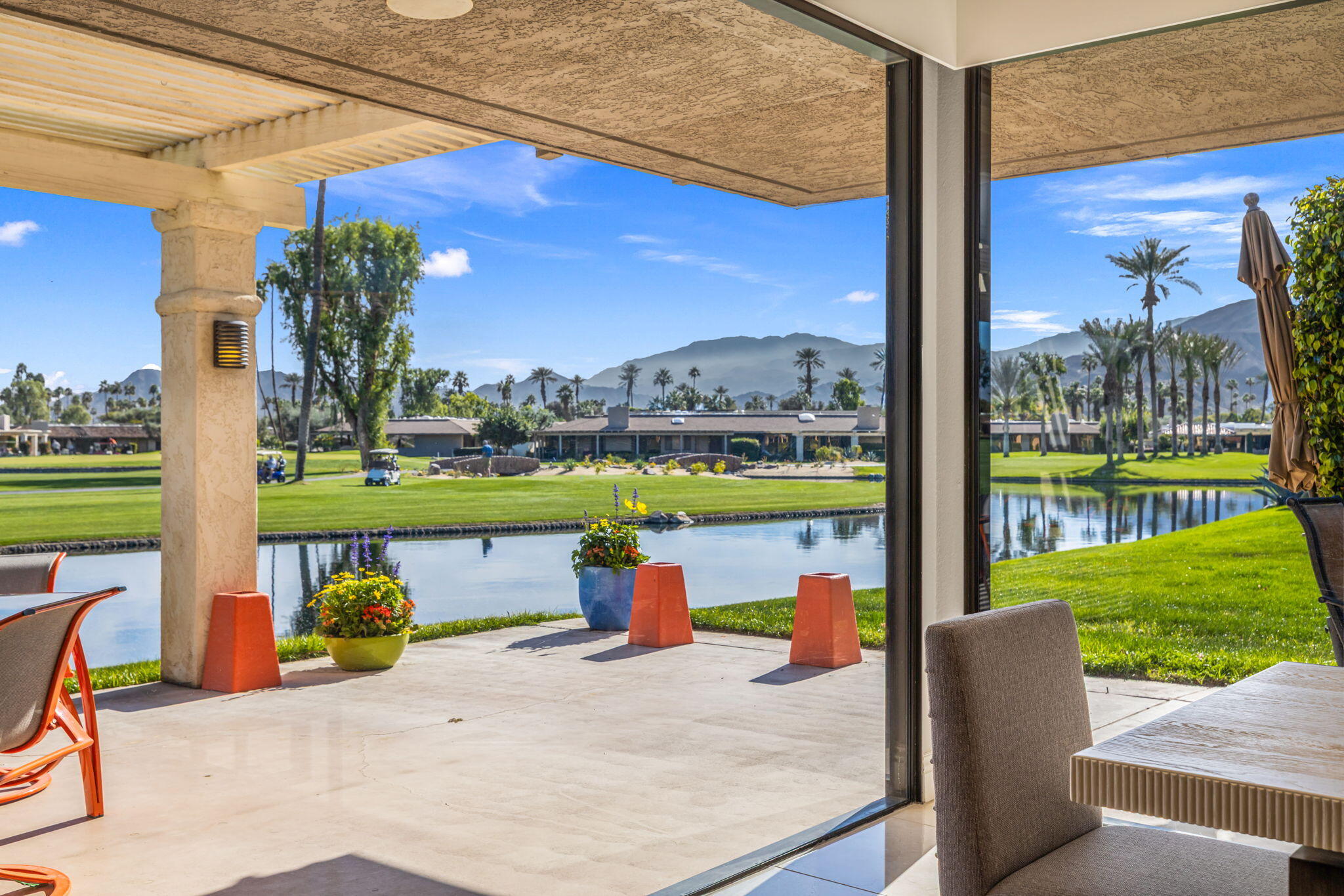 a view of a swimming pool with a patio