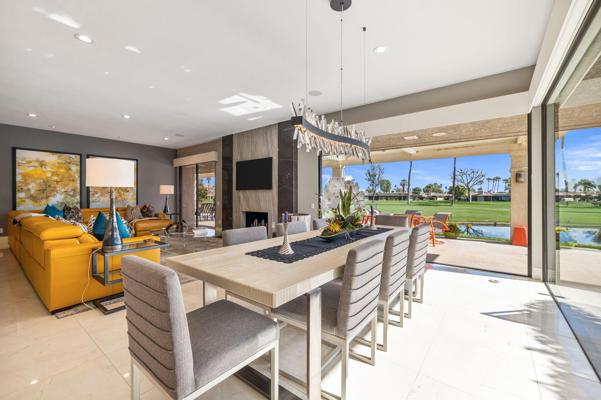 6 Barnard Court Rancho Mirage, CA 92270 - Photo 13 of 58 a view of a dining room with furniture large windows and garden view