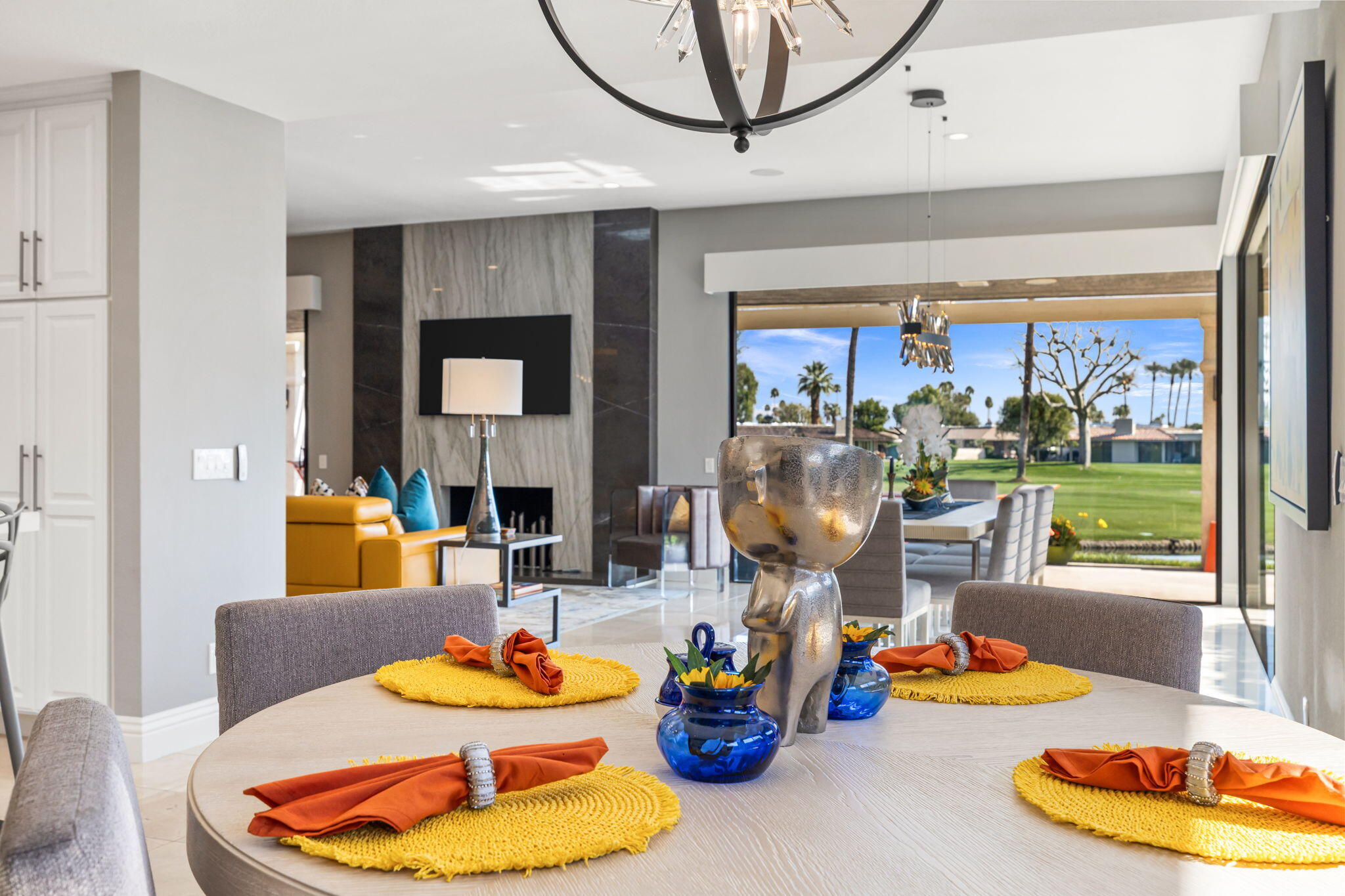 6 Barnard Court Rancho Mirage, CA 92270 - Photo 15 of 58 a living room with furniture and a floor to ceiling window