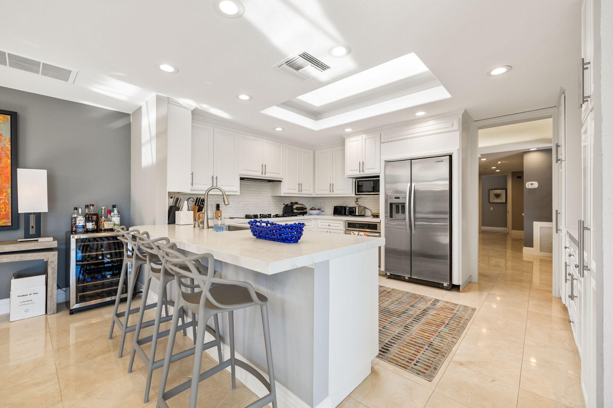 6 Barnard Court Rancho Mirage, CA 92270 - Photo 18 of 58 a kitchen with stainless steel appliances kitchen island granite countertop a refrigerator and a stove top oven