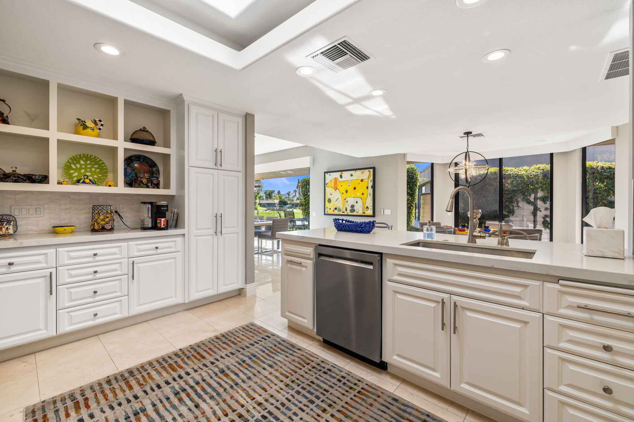 6 Barnard Court Rancho Mirage, CA 92270 - Photo 20 of 58 a kitchen with stainless steel appliances granite countertop a sink and cabinets