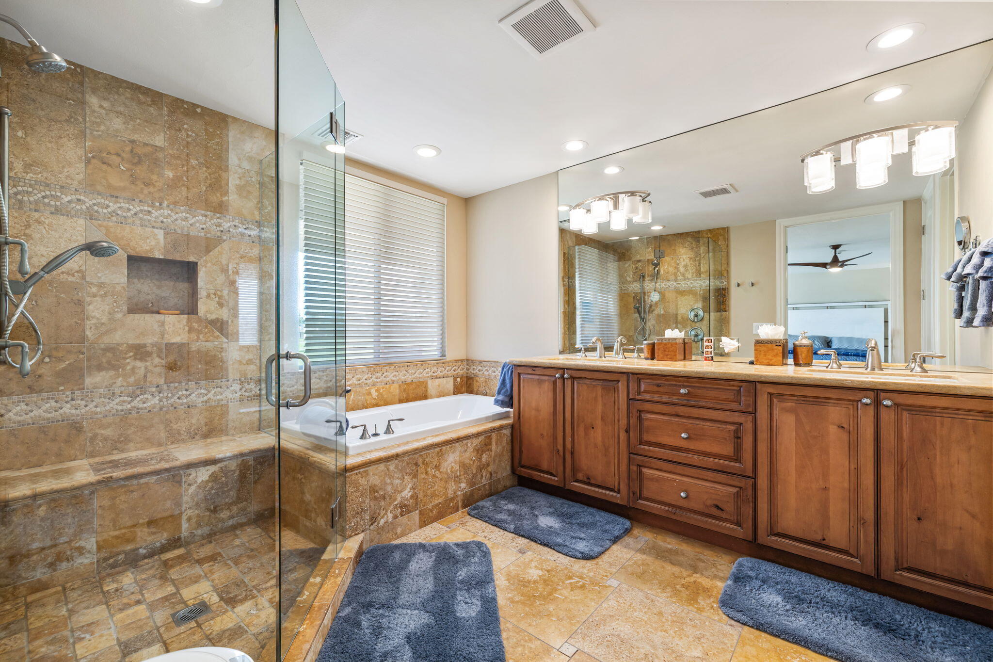 6 Barnard Court Rancho Mirage, CA 92270 - Photo 32 of 58 a spacious bathroom with a tub sink shower and mirror