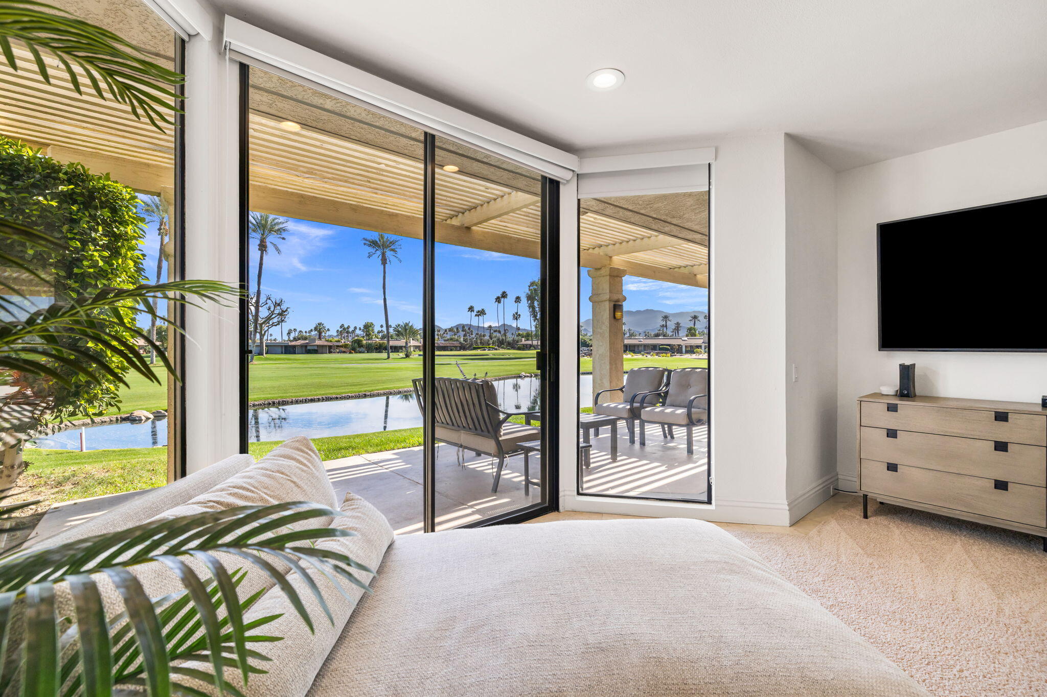 6 Barnard Court Rancho Mirage, CA 92270 - Photo 34 of 58 a bed room with a bed and a television