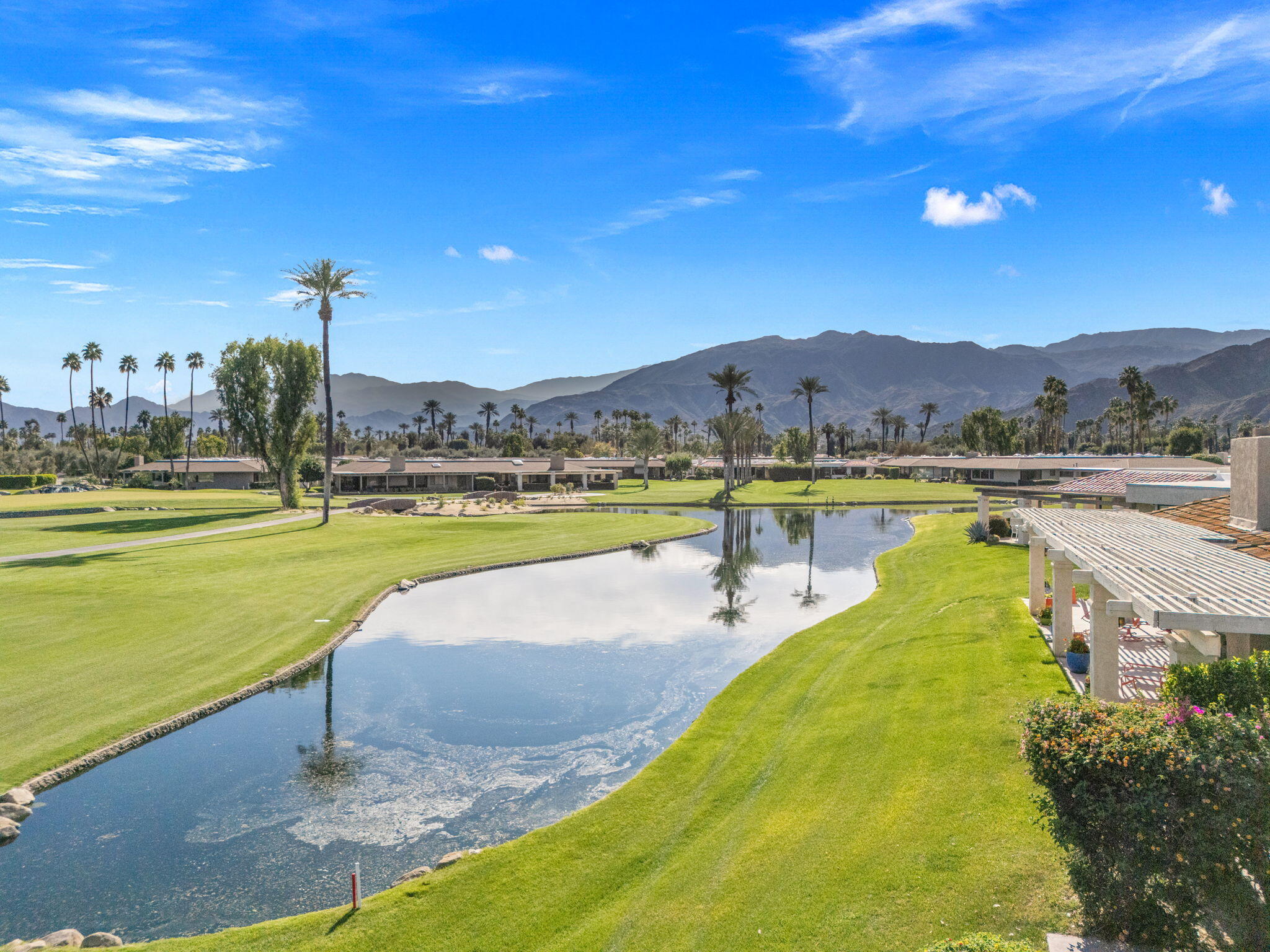 6 Barnard Court Rancho Mirage, CA 92270 - Photo 43 of 58 a view of a lake with a mountain in the background