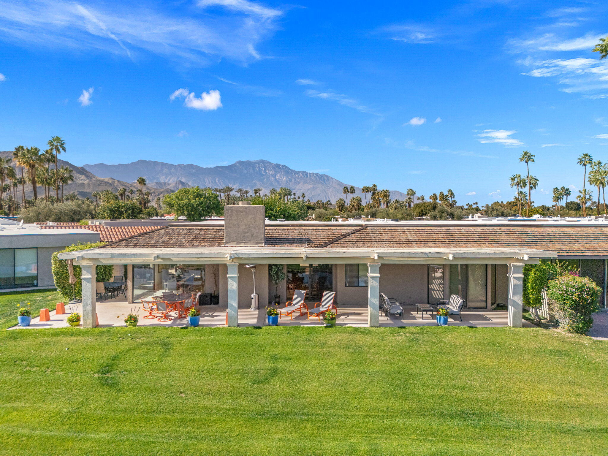 6 Barnard Court Rancho Mirage, CA 92270 - Photo 44 of 58 a view of a house with a yard balcony and furniture