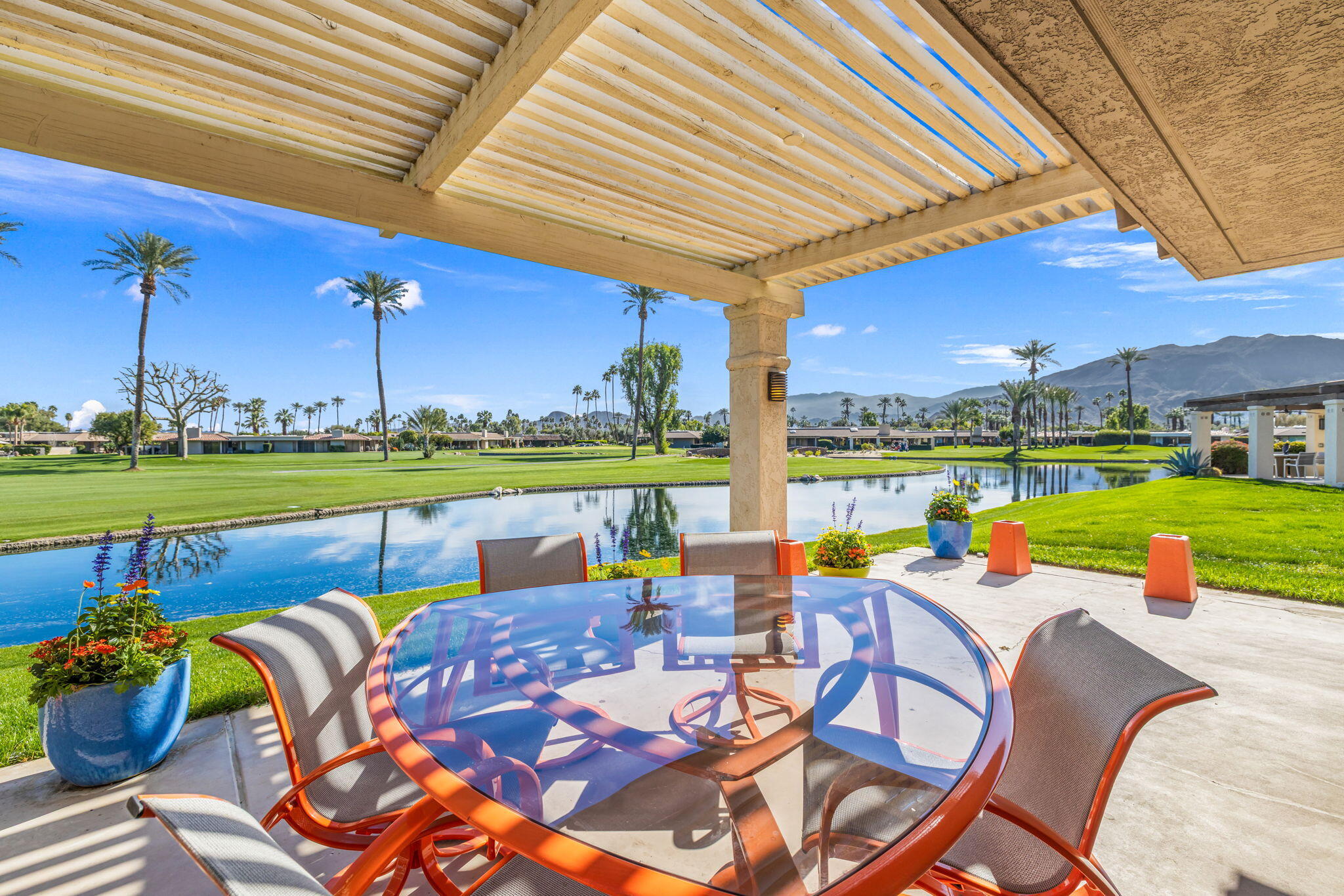 6 Barnard Court Rancho Mirage, CA 92270 - Photo 55 of 58 a view of swimming pool and chairs in patio