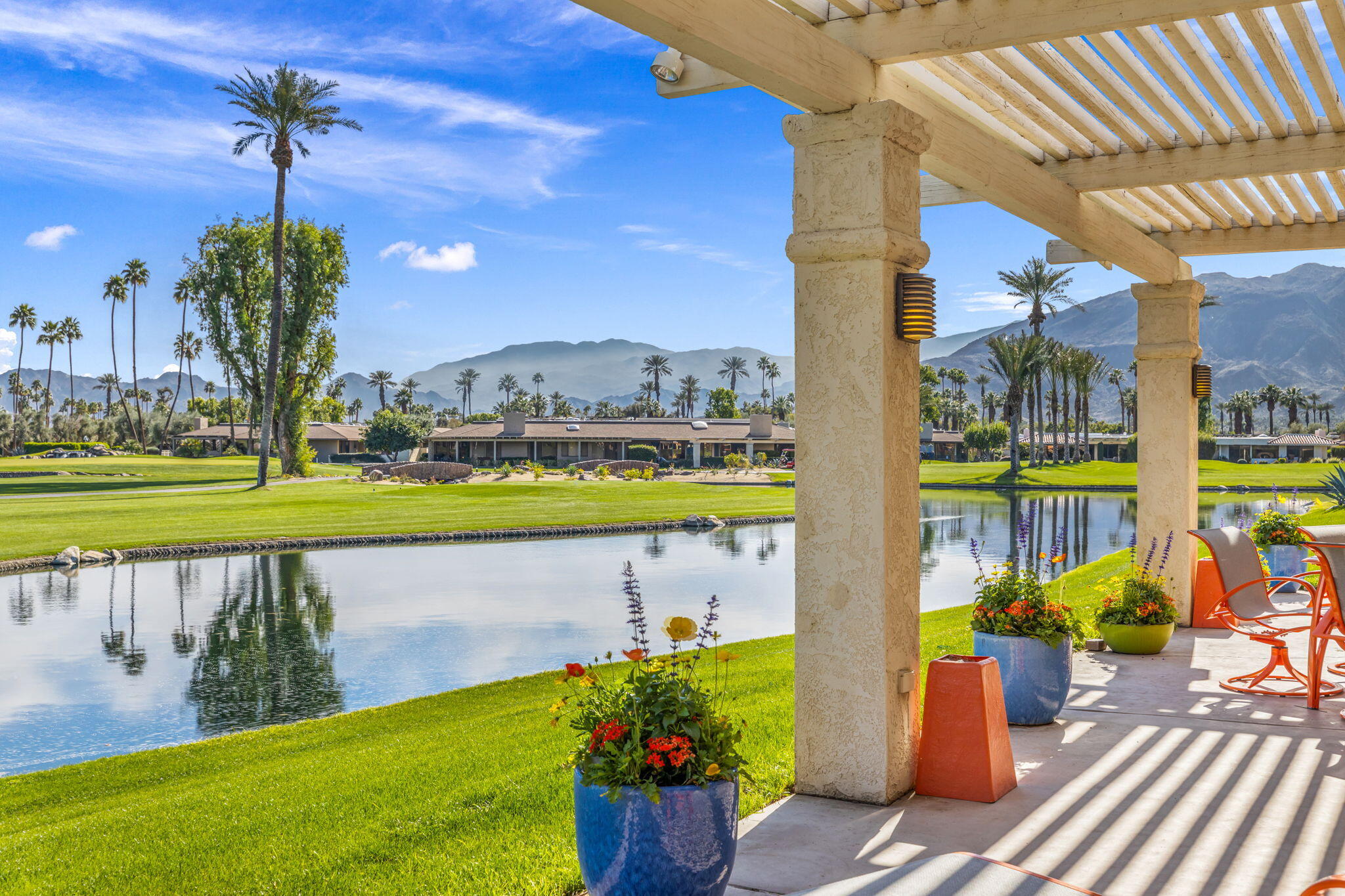 6 Barnard Court Rancho Mirage, CA 92270 - Photo 56 of 58 a view of a swimming pool with a patio