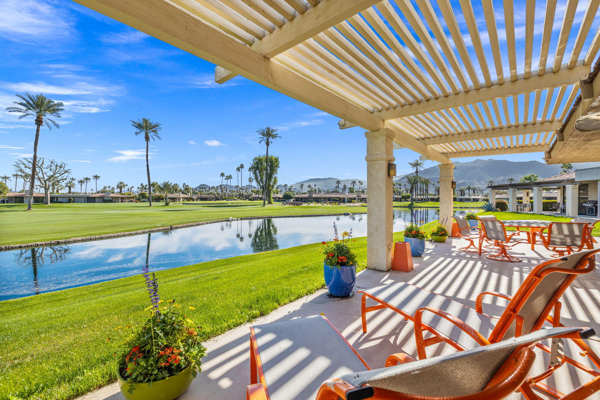 6 Barnard Court Rancho Mirage, CA 92270 - Photo 57 of 58 a view of a swimming pool and outdoor seating