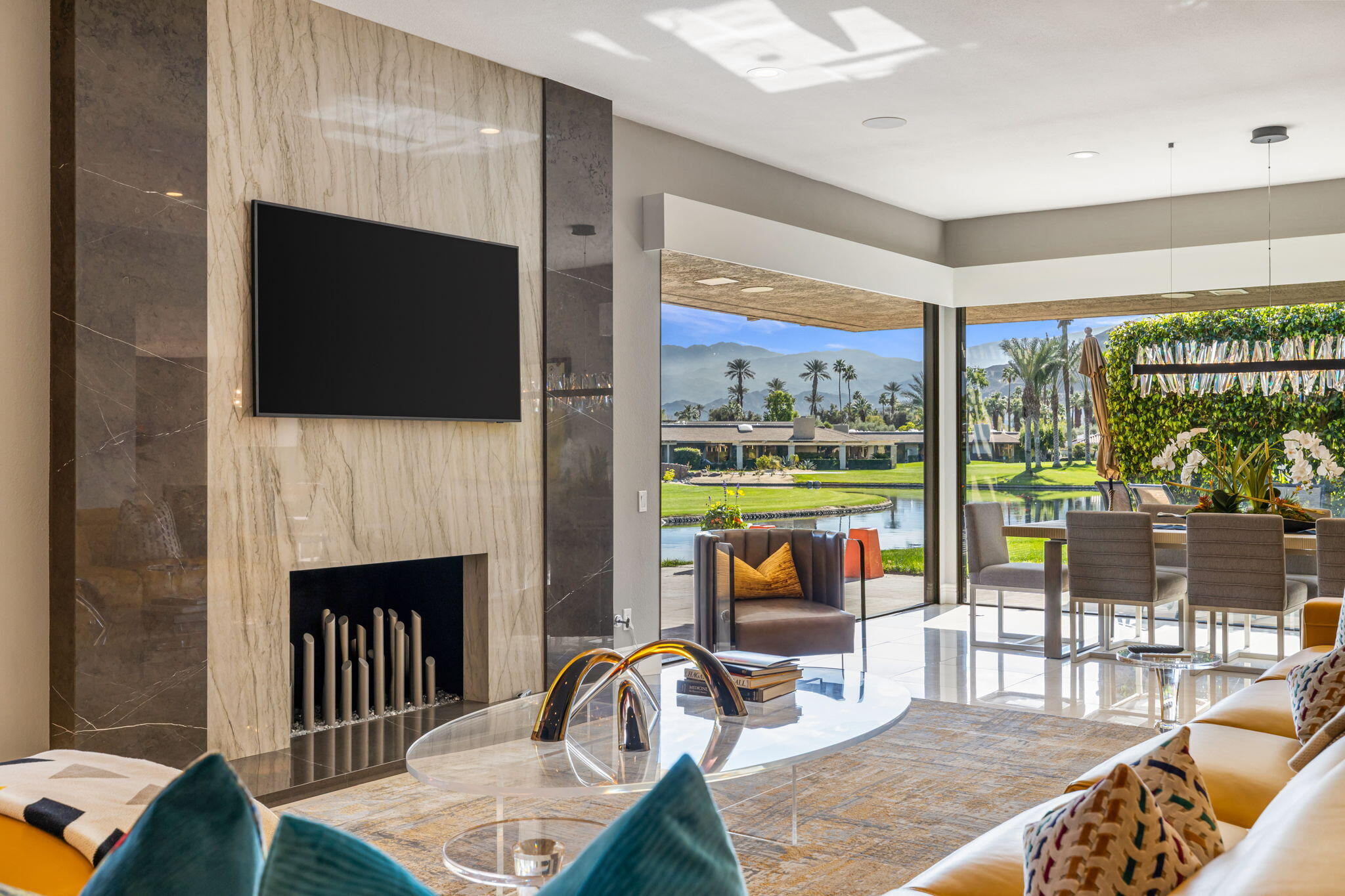 6 Barnard Court Rancho Mirage, CA 92270 - Photo 6 of 58 a living room with fireplace furniture and a flat screen tv