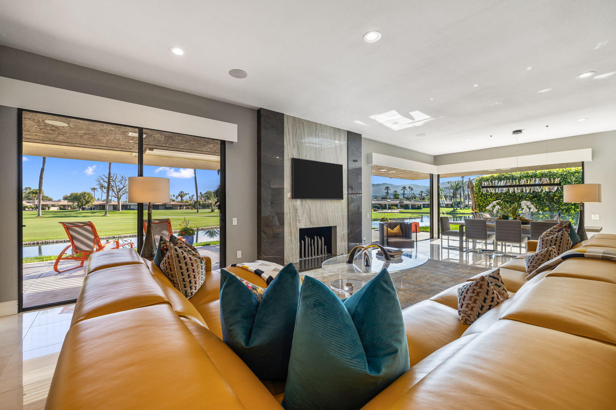 6 Barnard Court Rancho Mirage, CA 92270 - Photo 7 of 58 a living room with fireplace furniture and a large window