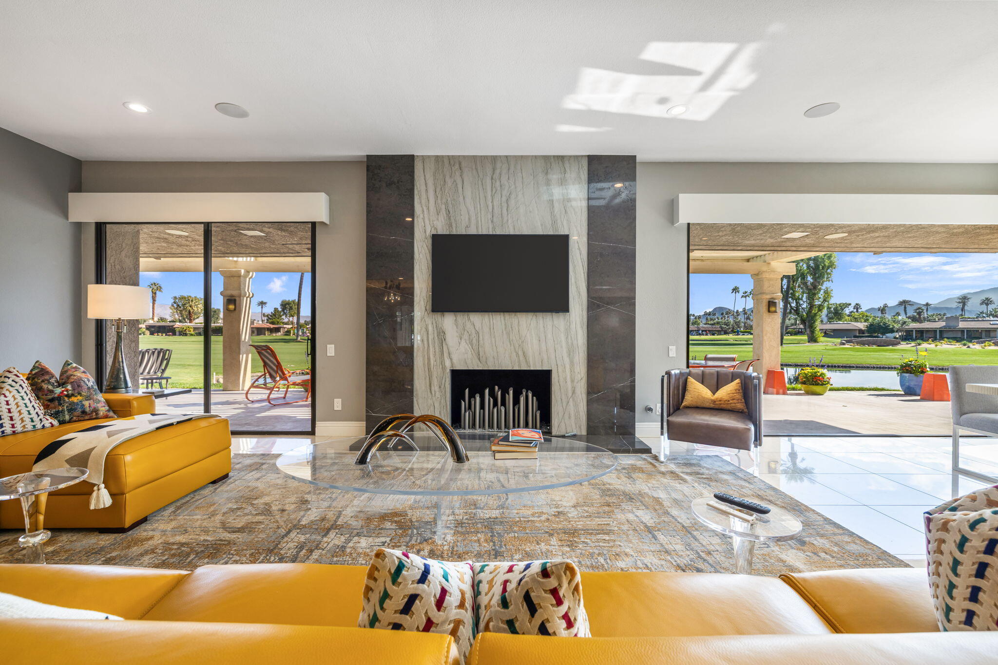 6 Barnard Court Rancho Mirage, CA 92270 - Photo 8 of 58 a living room with furniture and a fireplace