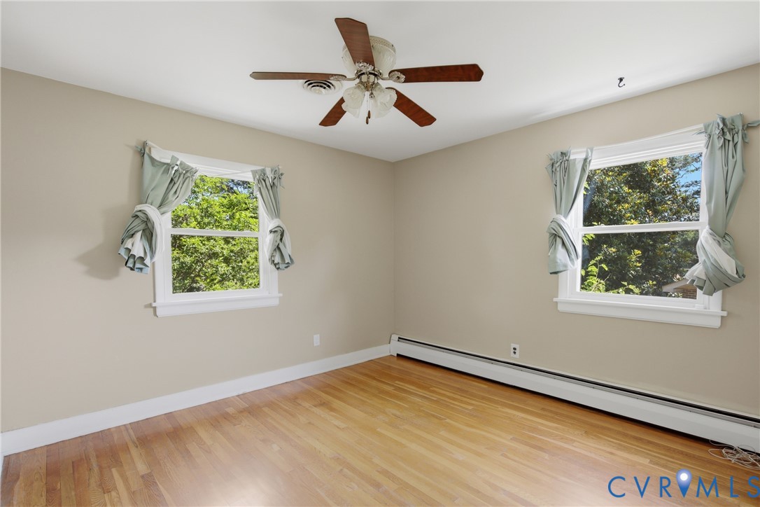 8210 Ireton Road Henrico, VA 23228 - Photo 20 of 36 an empty room with wooden floor and windows