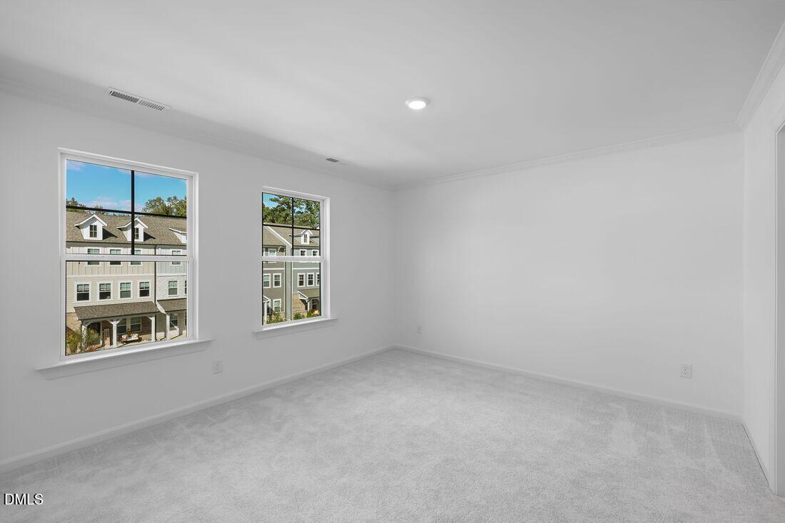 430 Rowe Way Knightdale, NC 27545 - Photo 17 of 51 an empty room with windows