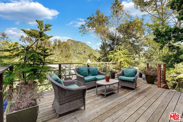 a outdoor living space with furniture and garden view