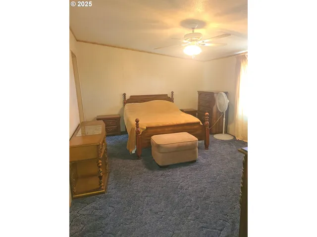 a bedroom with a bed and a cabinets