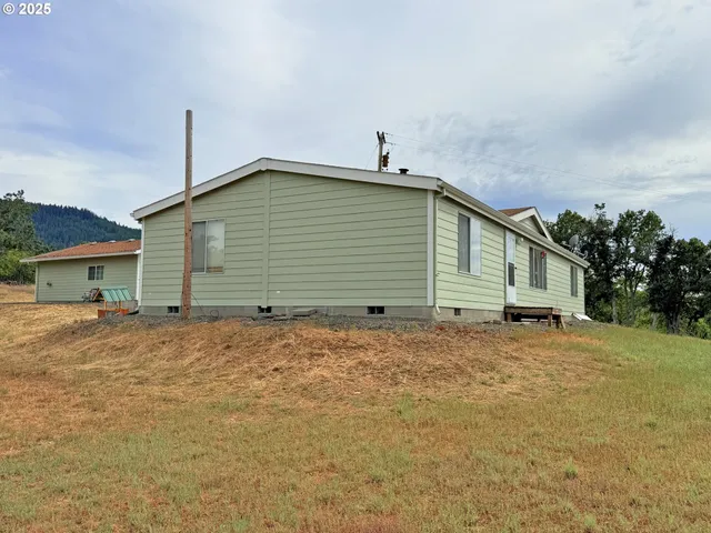a house with trees in the background