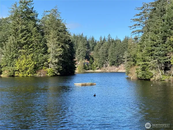 a view of a lake with houses with outdoor space
