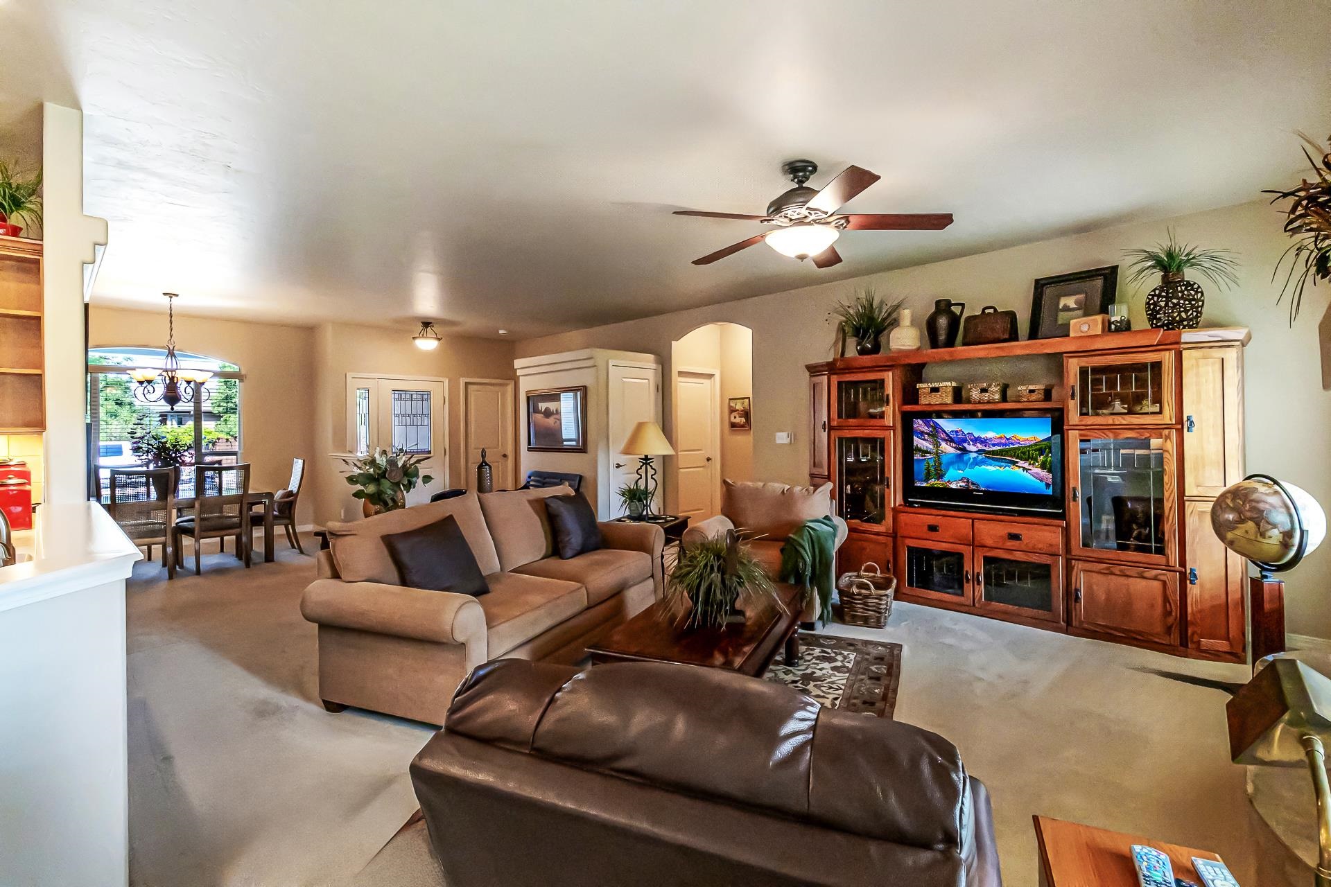 964 Murray Street Fruita, CO 81521 - Photo 3 of 24 a living room with furniture and a flat screen tv