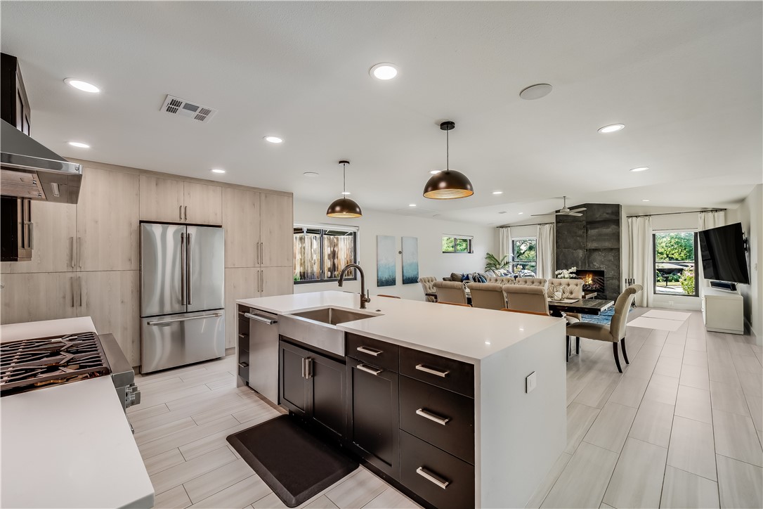 1908 Cedar Ridge Drive Austin, TX 78741 - Photo 1 of 1 a kitchen with stainless steel appliances granite countertop a sink stove and refrigerator