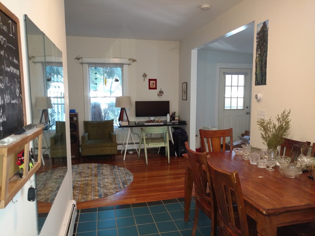 26 Hingham Street, Unit 2 Cambridge, MA 02138 - Photo 11 of 11 a living room with furniture a dining table and a window