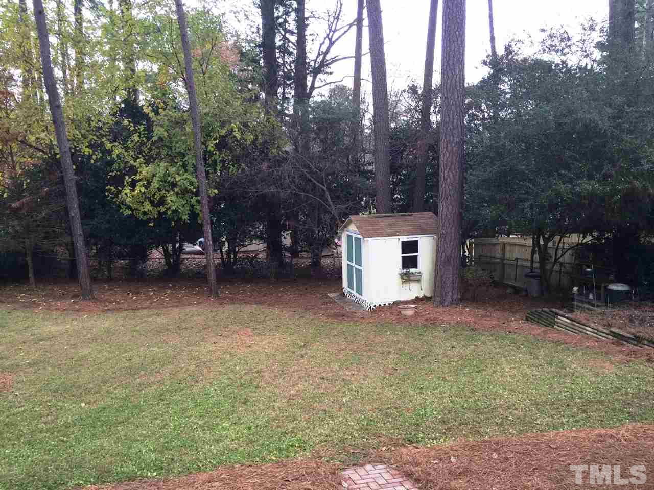 505 East Millbrook Road Raleigh, NC 27609 - Photo 2 of 25 a view of a house with a yard