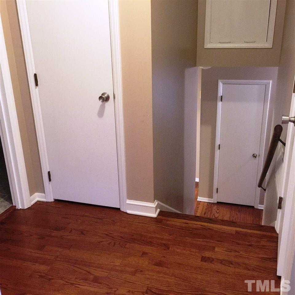 505 East Millbrook Road Raleigh, NC 27609 - Photo 11 of 25 a view of an empty room with wooden floor and a window
