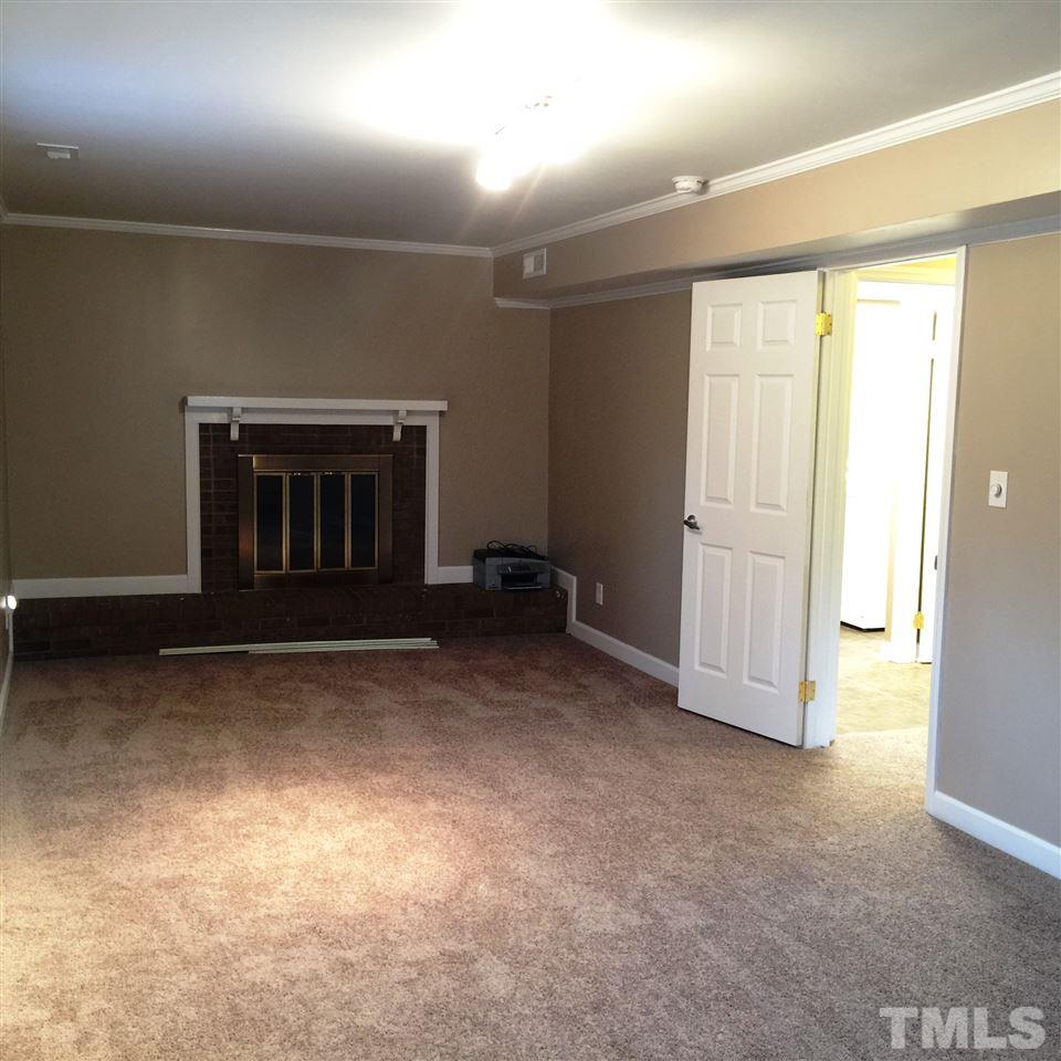 505 East Millbrook Road Raleigh, NC 27609 - Photo 13 of 25 an empty room with windows
