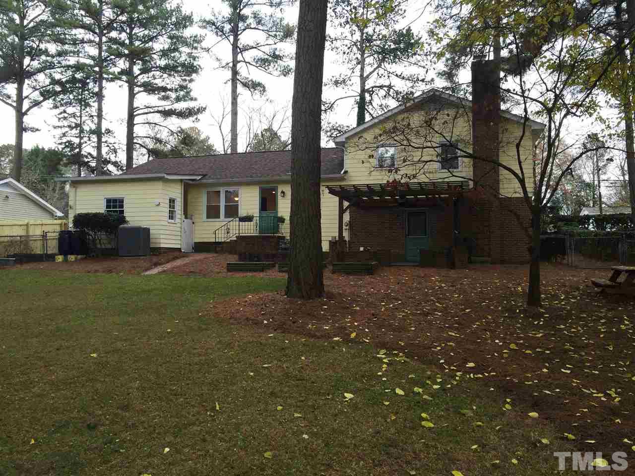 505 East Millbrook Road Raleigh, NC 27609 - Photo 15 of 25 a view of a house with a yard