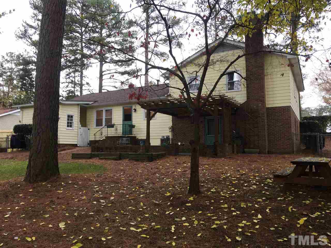 505 East Millbrook Road Raleigh, NC 27609 - Photo 17 of 25 a front view of a house with garden