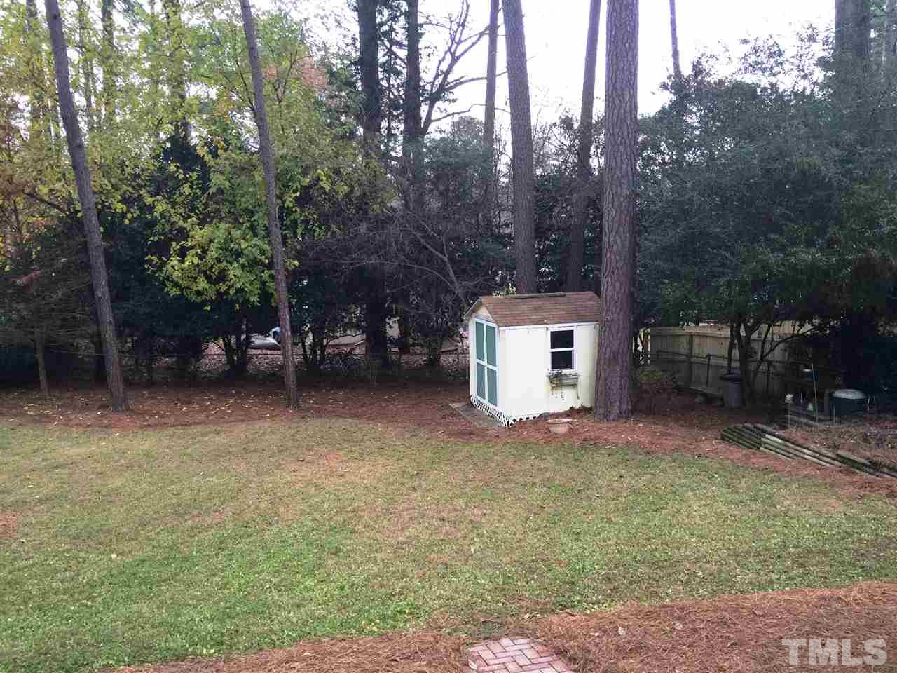 505 East Millbrook Road Raleigh, NC 27609 - Photo 23 of 25 a view of a house with a yard and tree