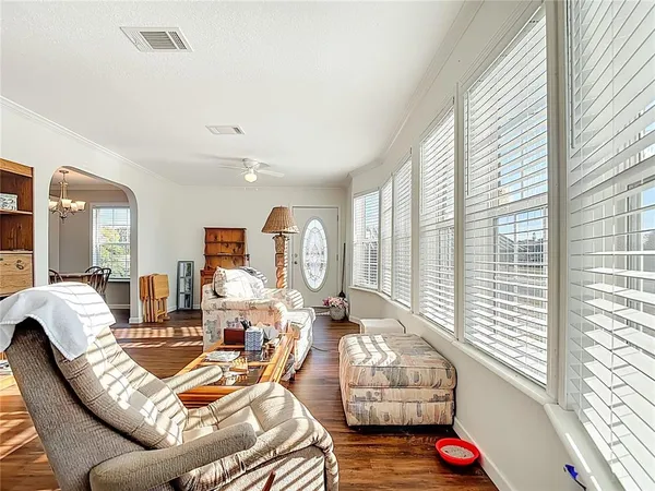 a living room with furniture and a window