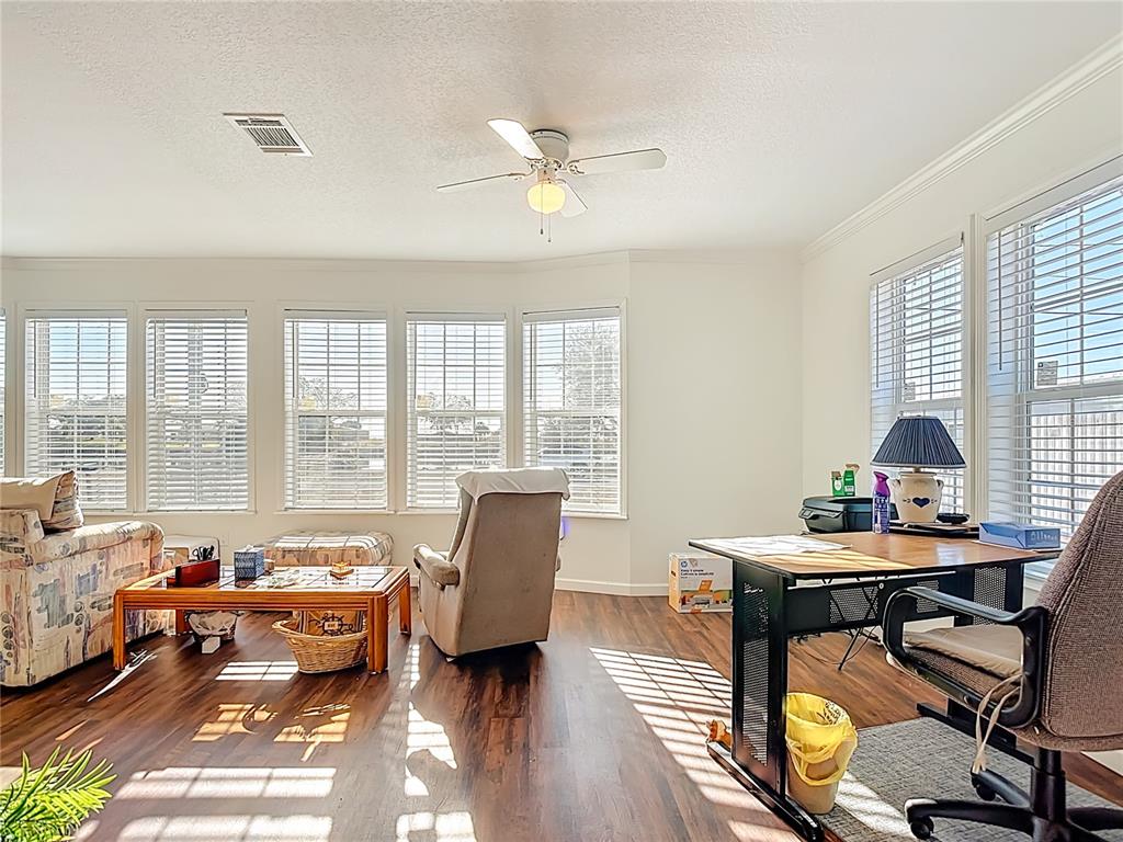 1824 Riverside Drive Moore Haven, FL 33471 - Photo 13 of 66 a living room with furniture and a window