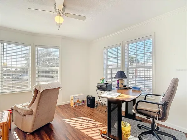 a kitchen with a stove a refrigerator and a fireplace