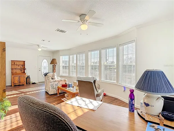a kitchen with cabinets oven and a dishwasher with wooden floor