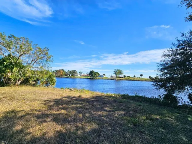 a view of lake with mountain in the background
