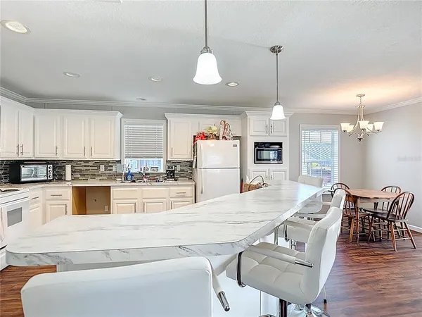 a living room with furniture and a lamp