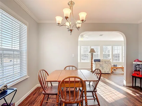 a living room with furniture and a lamp