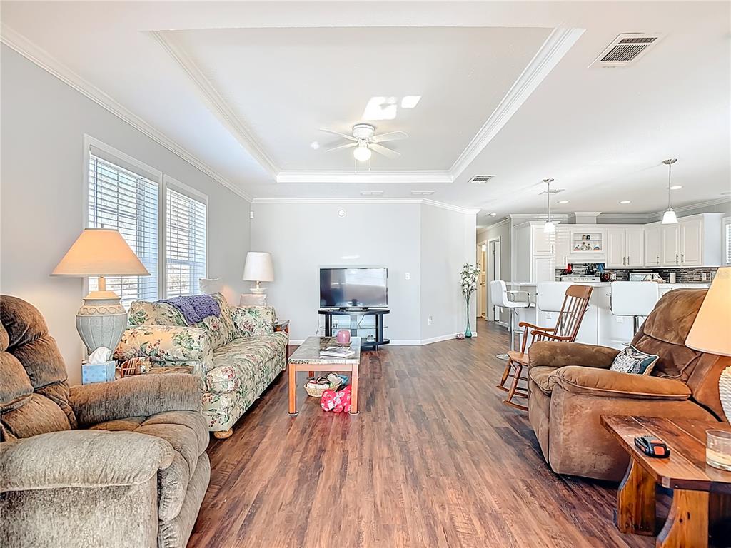 1824 Riverside Drive Moore Haven, FL 33471 - Photo 27 of 66 a living room with furniture and a lamp