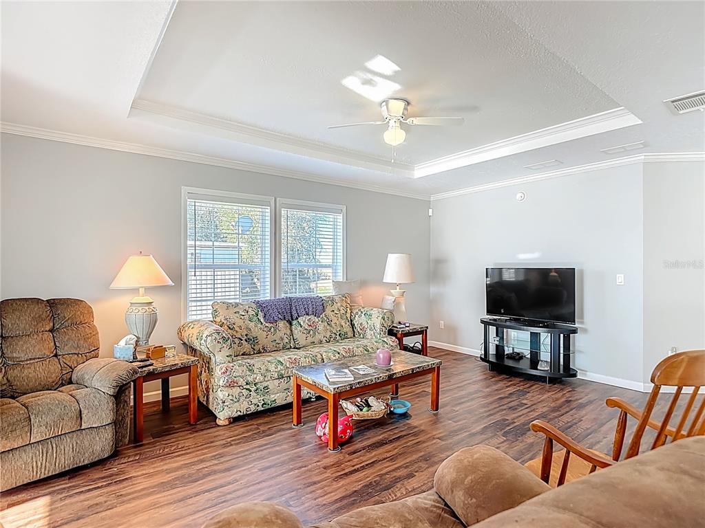 1824 Riverside Drive Moore Haven, FL 33471 - Photo 28 of 66 a living room with furniture and a flat screen tv
